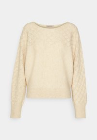 Pull en maille couleur crème avec texture en motif losange sur les manches et le haut de la poitrine, doté de manches longues, de poignets et d'un ourlet côtelés.