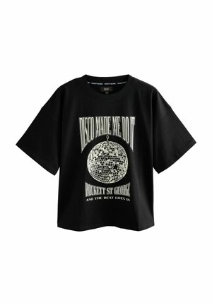 Black cotton t-shirt with short sleeves, featuring a white graphic of a disco ball and text reading "DISCO MADE ME DO IT."