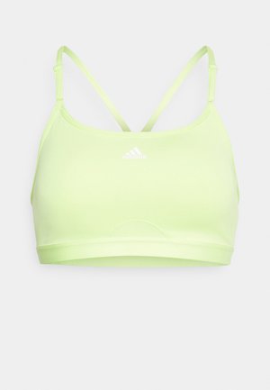 Světlá zelená sportovní podprsenka s tenkými křížovými ramínky, hladkým povrchem a vyšívaným logem Adidas uprostřed přední části.