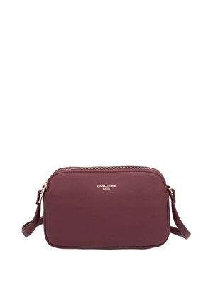 Burgundy leather crossbody bag with a zip closure, rectangular shape, and an adjustable strap. Features a metal logo in silver.