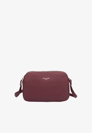 Burgundy leather crossbody bag with a zip closure, rectangular shape, and an adjustable strap. Features a metal logo in silver.