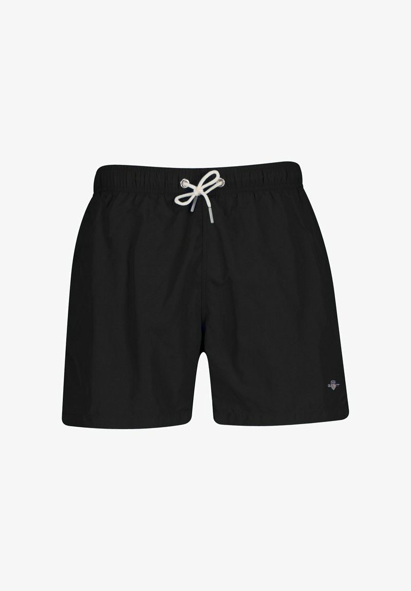 Shorts de bain noirs avec taille élastique et cordon blanc noué en nœud, avec un petit logo sur le côté inférieur droit.