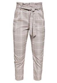 Rutiga byxor med bälte i midjan, tillverkade av ett lätt material. Har en neutral färgpalett av beige och svart. Kavat längd.