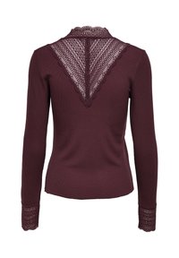 Long-sleeve burgundy top with lace detailing on upper back in a V shape and lace cuffs on sleeves.