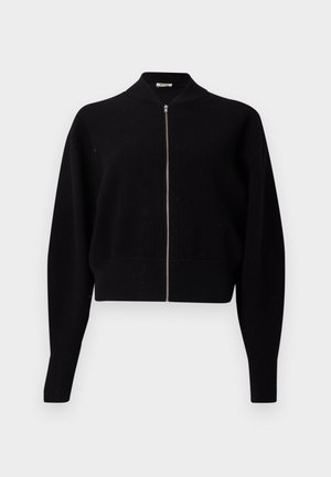 Cardigã preto canelado com fecho de correr, gola alta, mangas longas e design curto, apresentando um fecho de correr prateado e uma textura de canelado espesso.