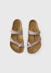 Two lavender cross-strap sandals with gold buckles, a contoured cork footbed, and a textured brown outsole. Size 38.