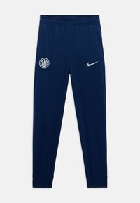 Tmavomodré športové nohavice vyrobené z jemného materiálu, s elastickým pásom, manžetami na koncoch a bielymi prvkami s logom.