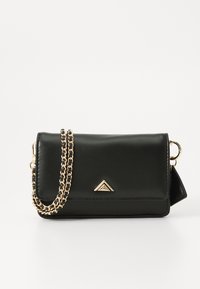 Black leather crossbody bag with a gold chain strap, triangular accent on the front, and a smooth texture. Compact rectangular shape.