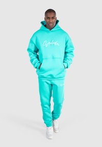 Smilodox CASUAL SLIM FIT KANE - Träningsbyxor - türkis