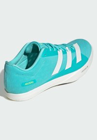 Turquoise athletic shoe with white accents and textured upper. Features a padded collar, flat laces, and a lightweight sole.
