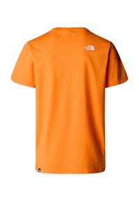 Orange bomulds T-shirt med korte ærmer, der har et lille hvidt logo på den øverste ryg og en glat, let tekstur.