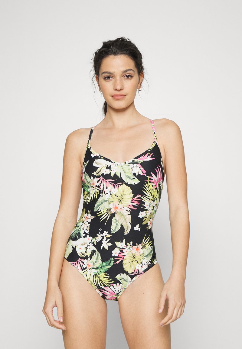 Fato de banho preto de uma peça só com padrões florais coloridos em rosa, verde e branco. Alças finas ajustáveis e decote em forma de barco.