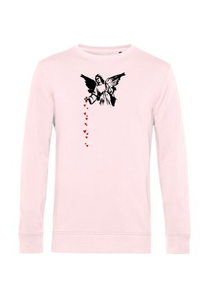 Lyserød langærmet skjorte med sort englegrafik på brystet, der udsender en lodret bane af små røde hjerter fra sin hånd.