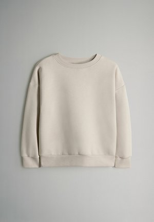 Beige crewneck sweatshirt lavet af blødt stof, med ribbet manchetter og kant, en glat tekstur og et afslappet fit design.
