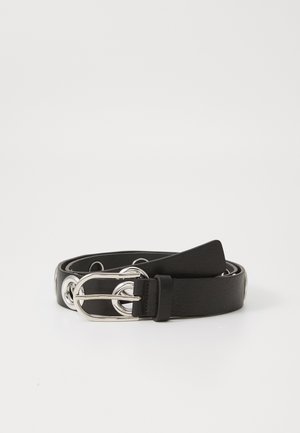 Black leather belt with a silver buckle featuring circular accents, flat strap, and a smooth texture. The end of the strap is tapered.