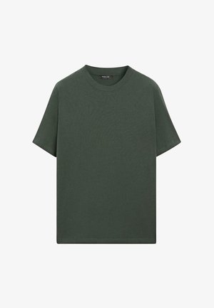 T-shirt verde scuro a maniche corte in morbido cotone con scollo rotondo e vestibilità comoda. Nessun motivo o logo visibile.