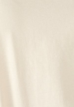 Tessuto di color crema chiaro con una texture morbida, liscia e un sottile motivo a trama.