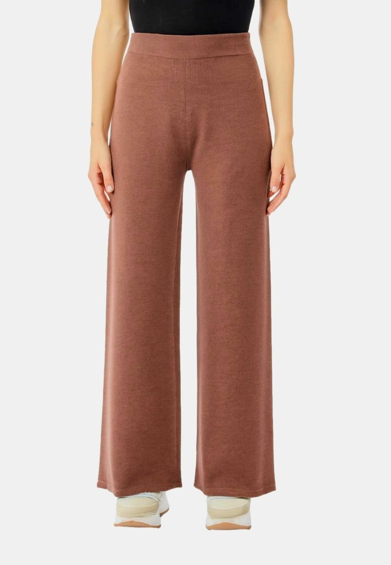 Pantaloni a gamba larga in un morbido tessuto brown testurizzato. Alta vita elastica. Design casual con una vestibilità rilassata. Adatti per l'uso quotidiano.