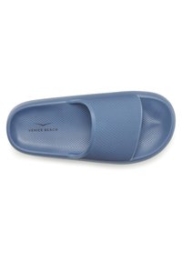 Blue slide sandal with a textured upper and perforated design. Features a wide strap and a cushioned sole for comfort.