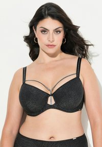 Musta rintaliivit, joissa on kimaltava pinta, avaimenreikädesign, säädettävät hihnat ja hopeiset koristelut.