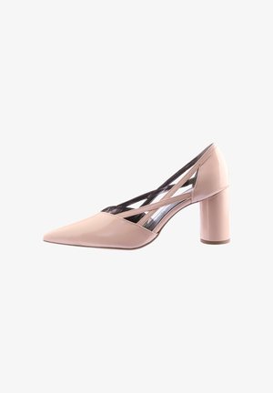 Beige patent leather women's pump with pointed toe, block heel, and crisscross strap details on inner side.