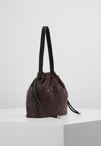 Drawstring handbag with a gathered top, covered in shiny burgundy beads. Features black leather handles and an adjustable cord for closure.