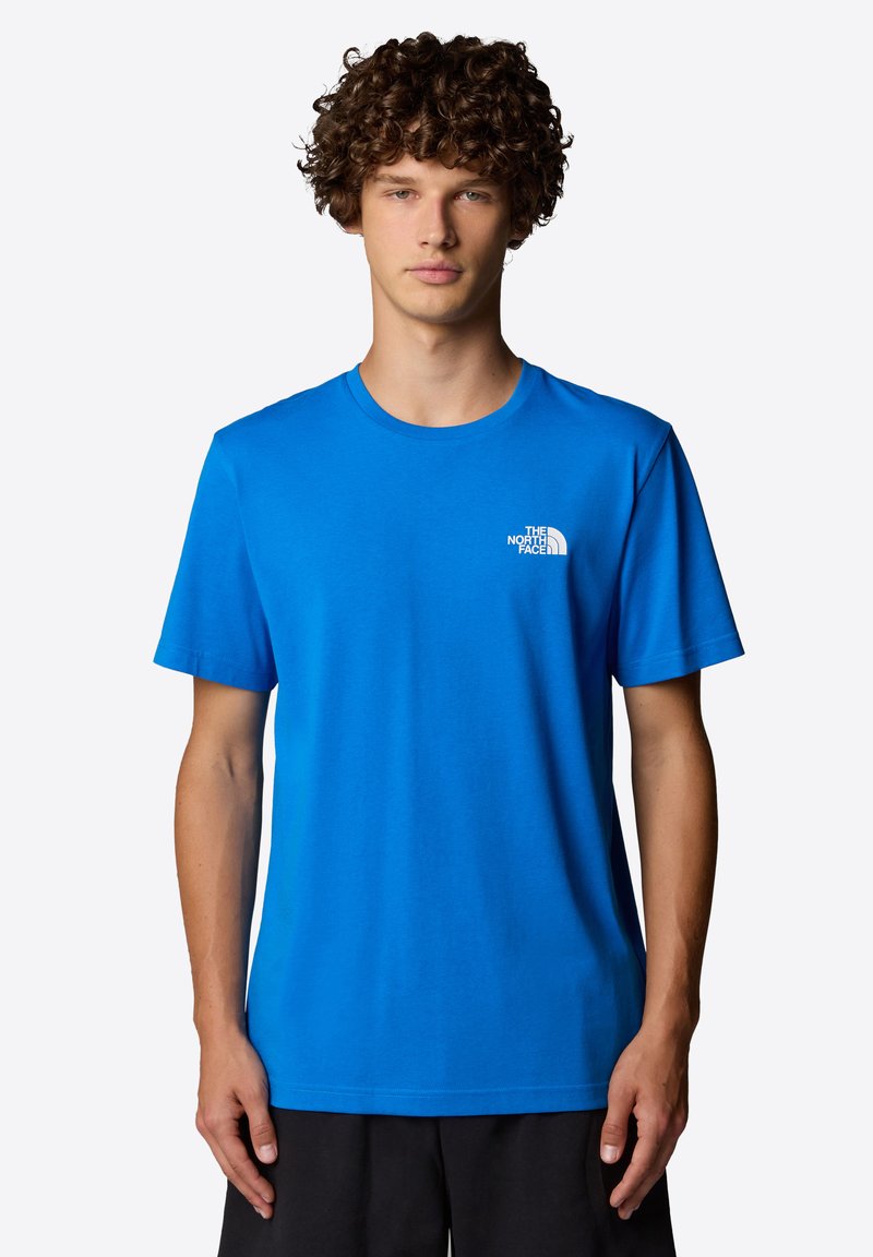 Blue crew-neck t-shirt made of cotton, featuring short sleeves and a small white logo on the left chest. Smooth texture, relaxed fit.