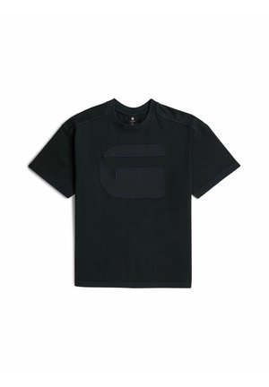 T-shirt noir à manches courtes avec un logo abstrait en relief et cousu à l'avant, et un col rond.