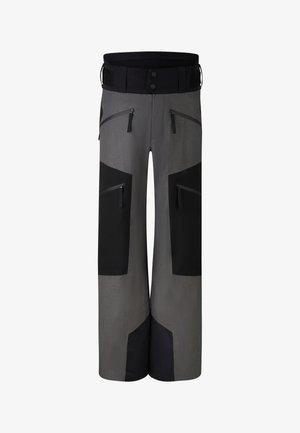 Graue Skihose mit schwarzen Akzenten, ausgestattet mit mehreren Reißverschlusstaschen, einem breiten Bund und einem lockeren Schnitt für Bewegungsfreiheit.