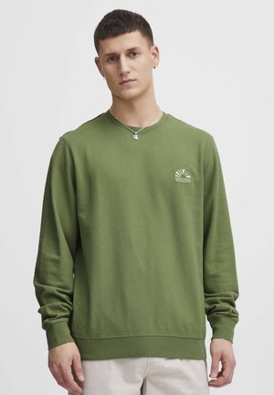 Olive green crewneck sweatshirt made of soft cotton, featuring ribbed cuffs and hem, with a small graphic print on the chest.