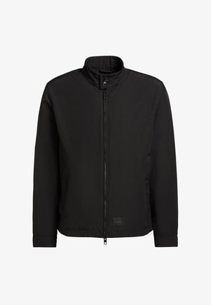 Zwarte lichtgewicht jas met opstaande kraag, ritssluiting aan de voorkant, drukknoopsluiting en lange mouwen.