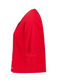 Lyhythihainen kirkkaan punainen neulejakku, jossa on V-pääntie ja valkoiset napit, esitelty sivulta valkoista taustaa vasten.