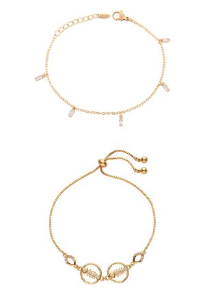 Two gold chain bracelets, one with five small rectangular clear charms, the other with adjustable clasp and two circular leaf charms.