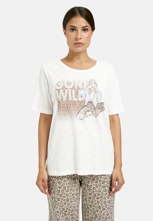 Short-sleeve white t-shirt featuring "GONE WILD" text, with a graphic of a woman on a leopard print background. Soft, textured fabric.