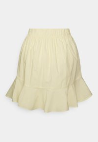 Saia de algodão amarelo-claro com cintura elástica, apresentando uma bainha em camadas com babados. A textura suave e o design esvoaçante proporcionam um ajuste relaxado.