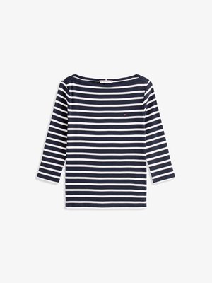 Chemise à rayures bleu marine et blanche à manches longues avec un col large et un petit logo sur la poitrine, fabriquée en tissu en coton doux.