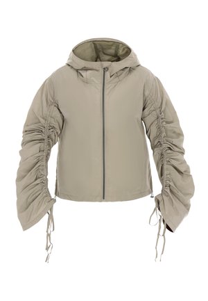 Let, beige hættejakke med rynkede ærmer og lynlås foran. Har snoretræk ved ærmekanter og kant, lavet af glat stof.