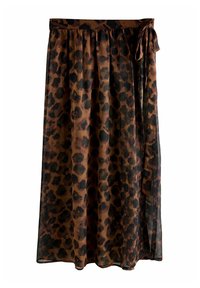 Jupe en imprimé léopard marron, fabriquée en tissu léger et transparent. Elle présente une taille élastique et un détail de lien sur le côté, tombant jusqu'aux chevilles.