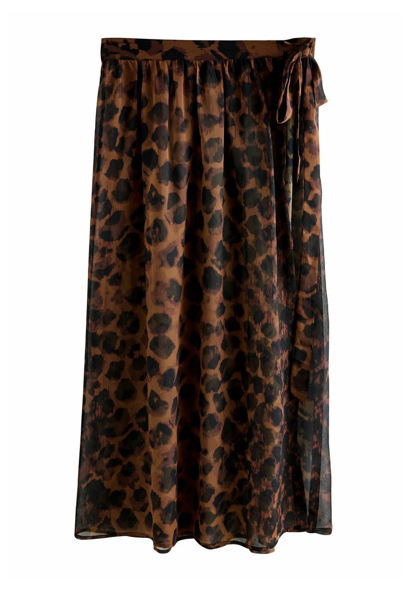 Jupe en imprimé léopard marron, fabriquée en tissu léger et transparent. Elle présente une taille élastique et un détail de lien sur le côté, tombant jusqu'aux chevilles.