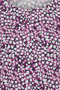 Cotton top featuring a navy base with a colorful, irregular dot pattern in pink, white, and burgundy. Notable button detail at neck.