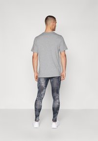 Nike Performance CAMO  - Leggings - black
