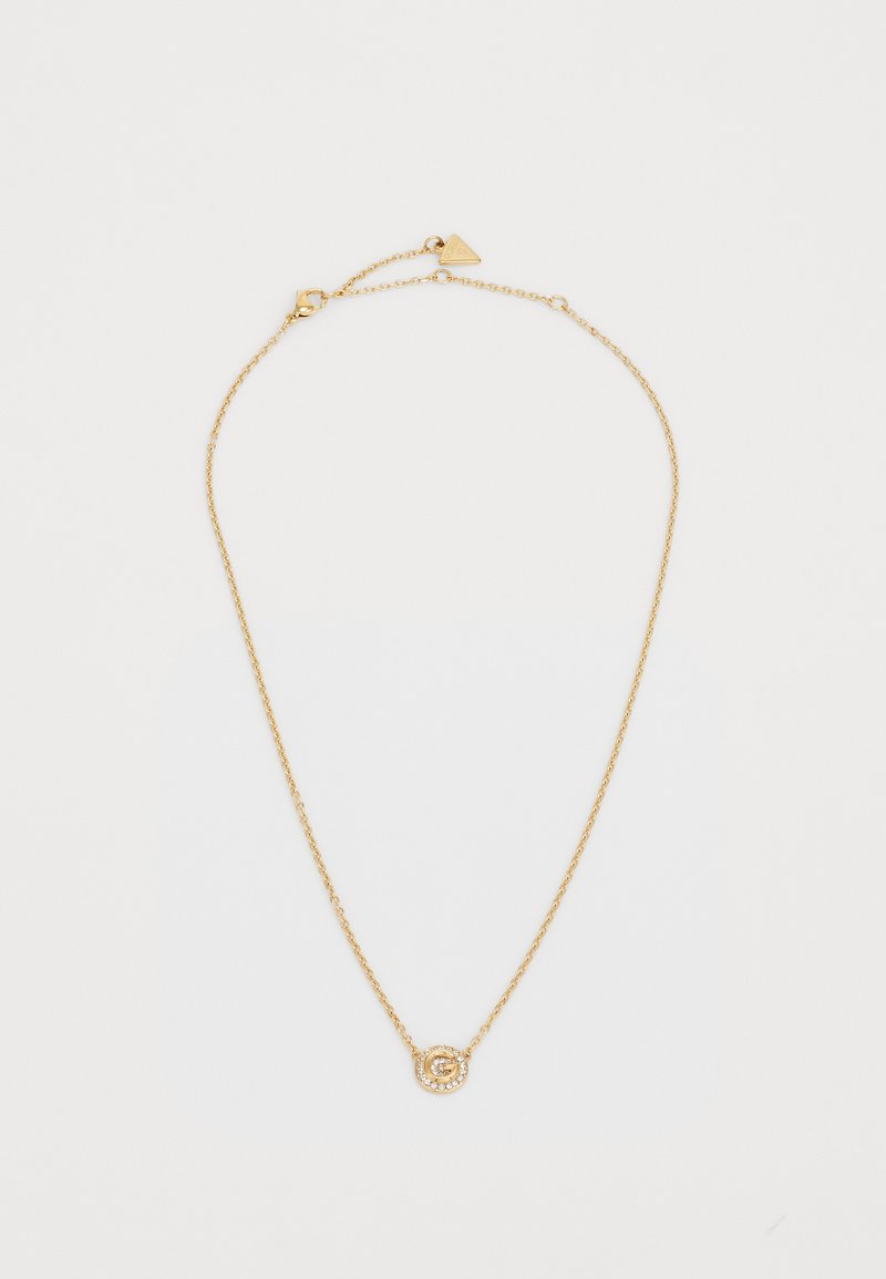 Collana in oro con pendente circolare. Il pendente presenta un design testurizzato circondato da piccoli gemme trasparenti. Lunghezza regolabile.