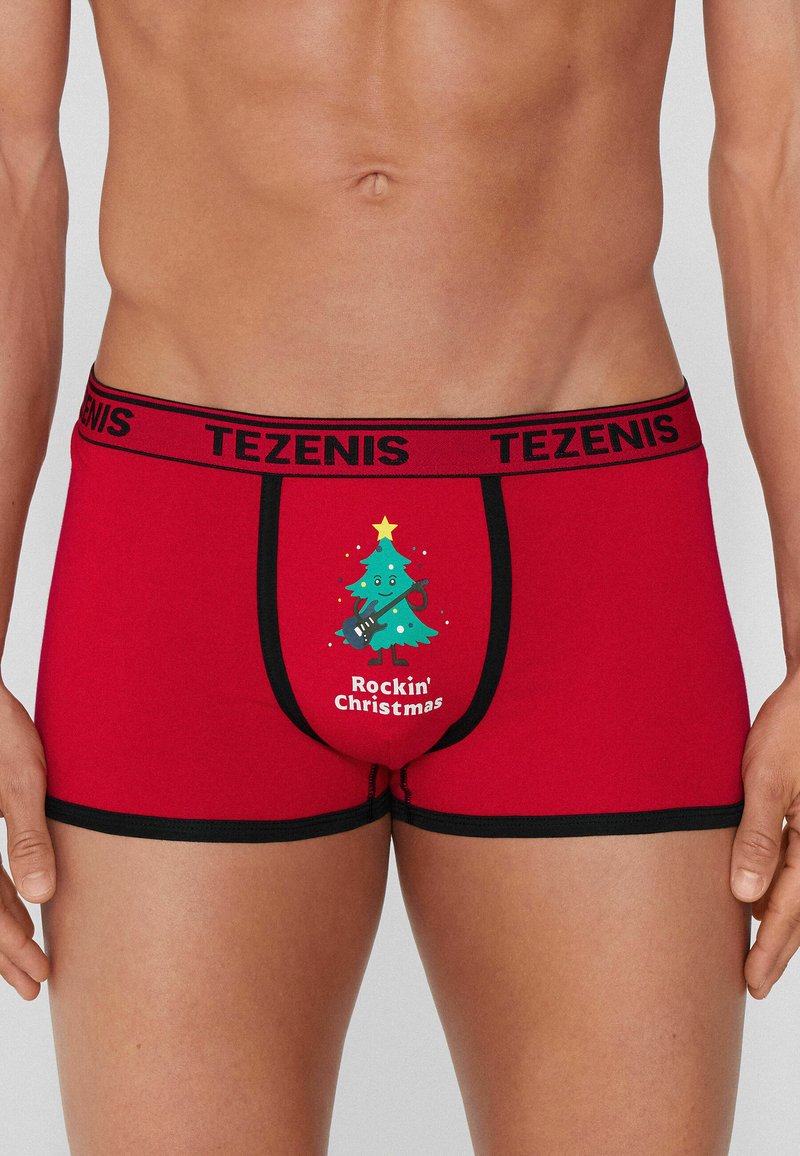 Czerwone slipy z grafiką w kształcie choinki bożonarodzeniowej trzymającej gitarę oraz napisem "Rockin' Christmas". Czarny pas z logo marki.