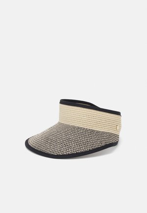 Bredskyggel vævet solskærm med beige topbånd, sort og hvid vævet skygge og sort kanttrim.