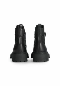Black leather ankle boots with a chunky rubber sole, featuring a sleek design and elastic side panels for easy wear.