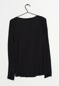 Black long-sleeve top made of soft fabric, featuring a relaxed fit, round neckline, and gathered cuffs for added texture.