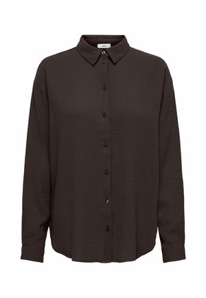 Fekete, gombos ing strukturált anyagból, hosszú ujjal és hegyes gallérral. Laza fazonú, az alján egyenes hem.