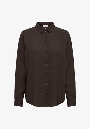 Chemise noire à boutons, en tissu texturé, avec des manches longues et un col pointu. Elle présente une coupe décontractée et un ourlet droit en bas.