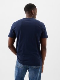 Navy blue cotton t-shirt with a classic round neckline and short sleeves, viewed from the back. Smooth texture, simple design.