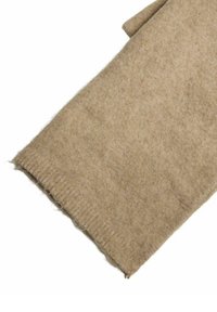 Beige wollen sjaal met een zachte, gestructureerde afwerking. De randen hebben een subtiele ribbelstructuur. Stof lijkt warm en gezellig.